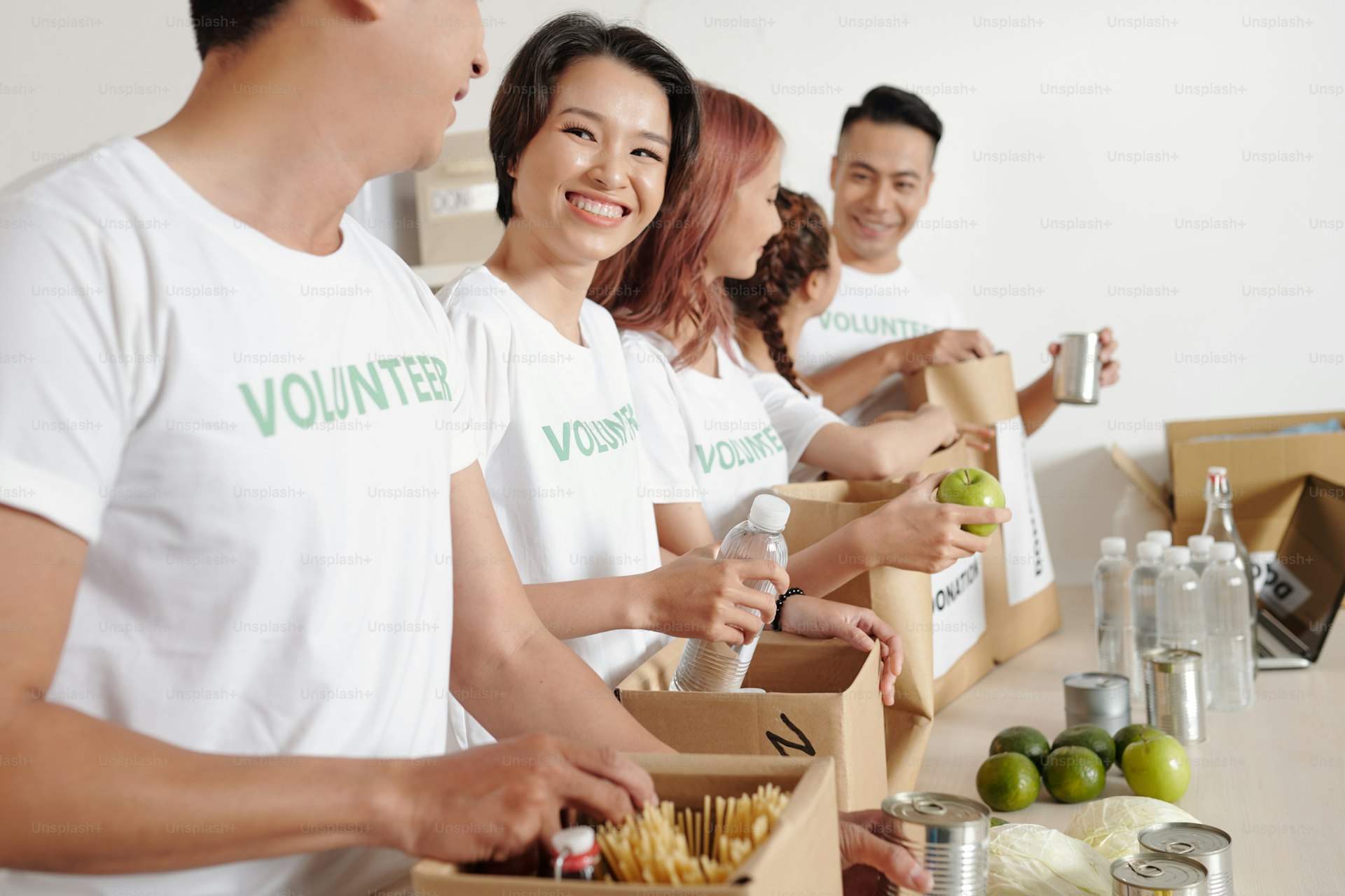 Volunteers packing donation boxes for a community foundation